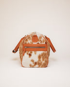Red Angus cowhide duffle carried by shoulder strap