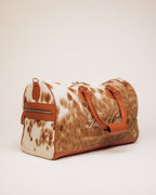 Red Angus cowhide duffle, top-down view