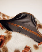 Cowhide duffle bag detail of hair-on hide pattern, Red Angus
