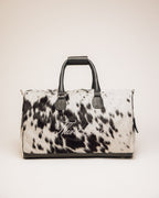 Black and white cowhide duffle bag with full-grain leather trim