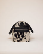 Cowhide duffle bag hardware and zipper detail, black and white