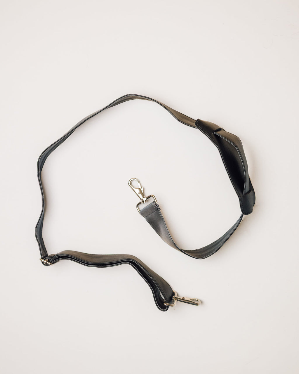 Black and white cowhide duffle, top-down view