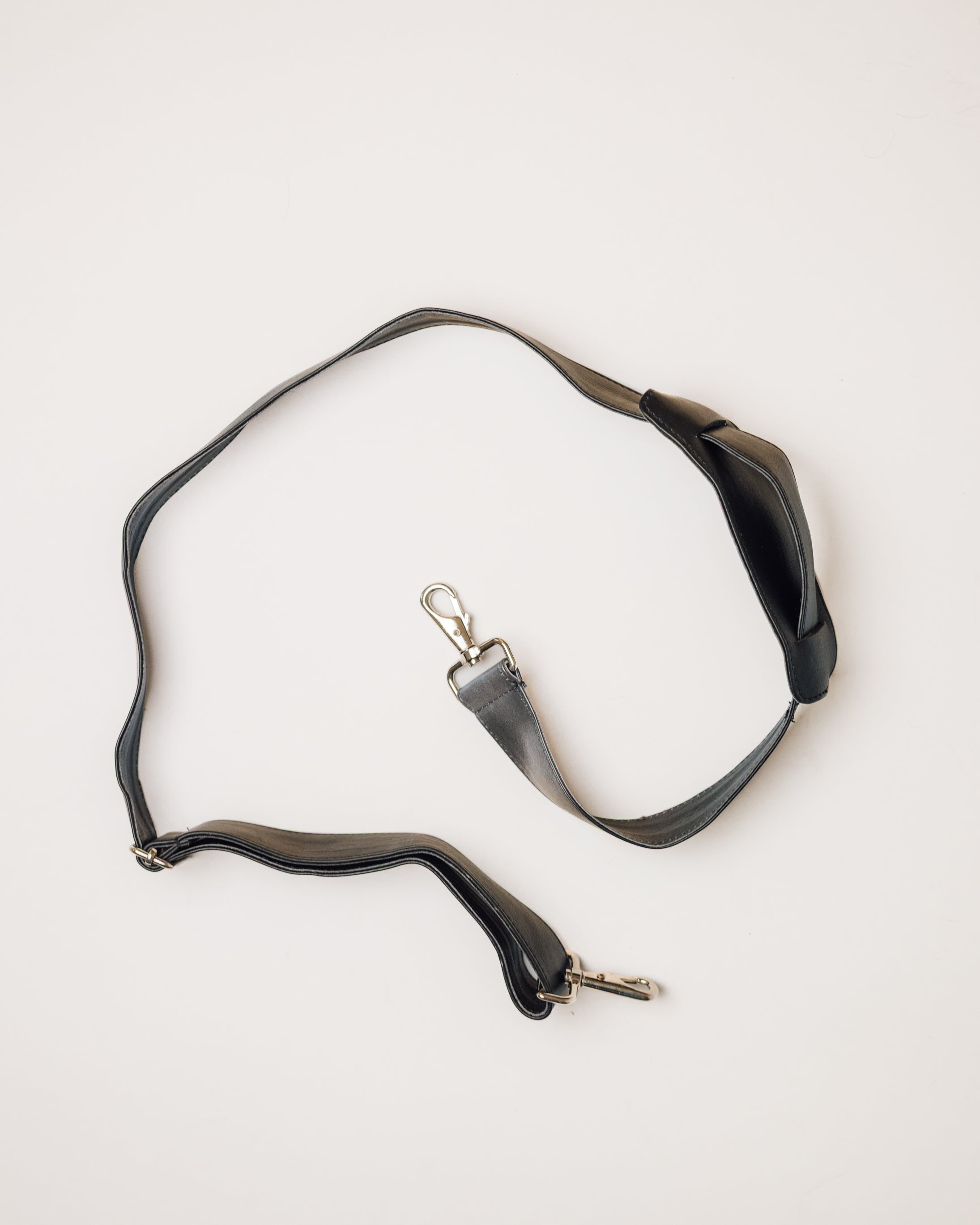 Black and white cowhide duffle, top-down view