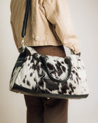Cowhide duffle bag detail of hair-on hide pattern, black and white