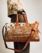 Red Angus cowhide duffle bag with full-grain leather trim