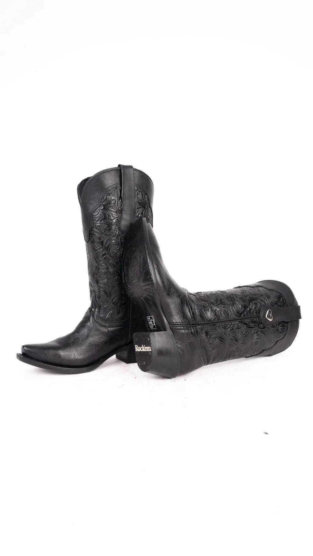 Sole and rubber heel cap of black tooled leather cowgirl boot