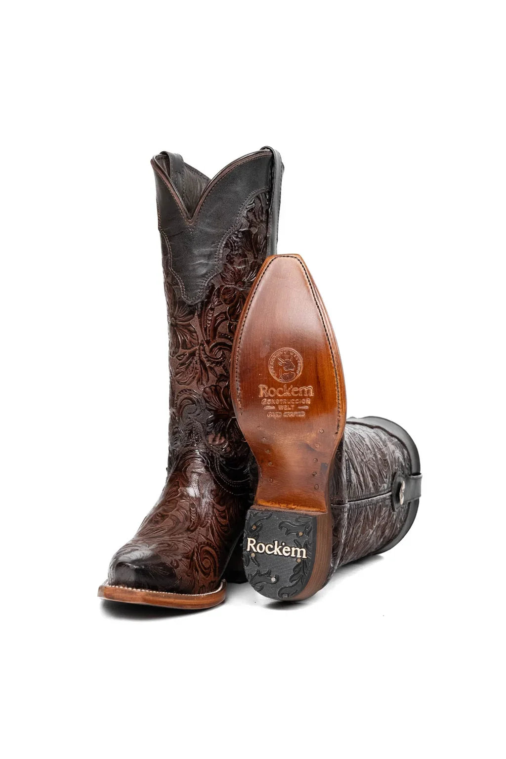 Sole and rubber heel cap of dark brown tooled leather cowgirl boot