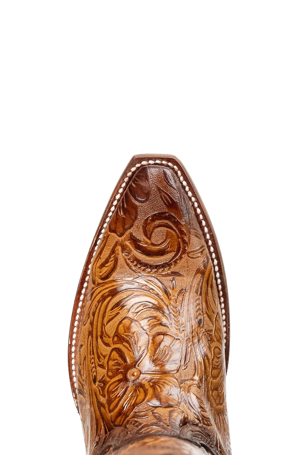 Close-up of hand-tooled floral pattern on tan leather cowgirl boot