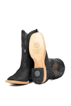 Leather sole and rubber heel cap of matte black python boot