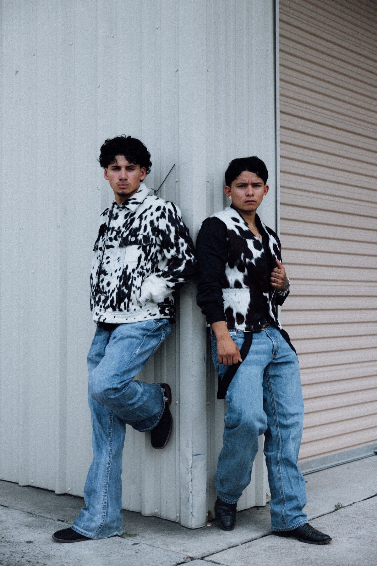 Andy and Gera, founders of Third Coast, in Heritage cowhide jackets against a warehouse wall