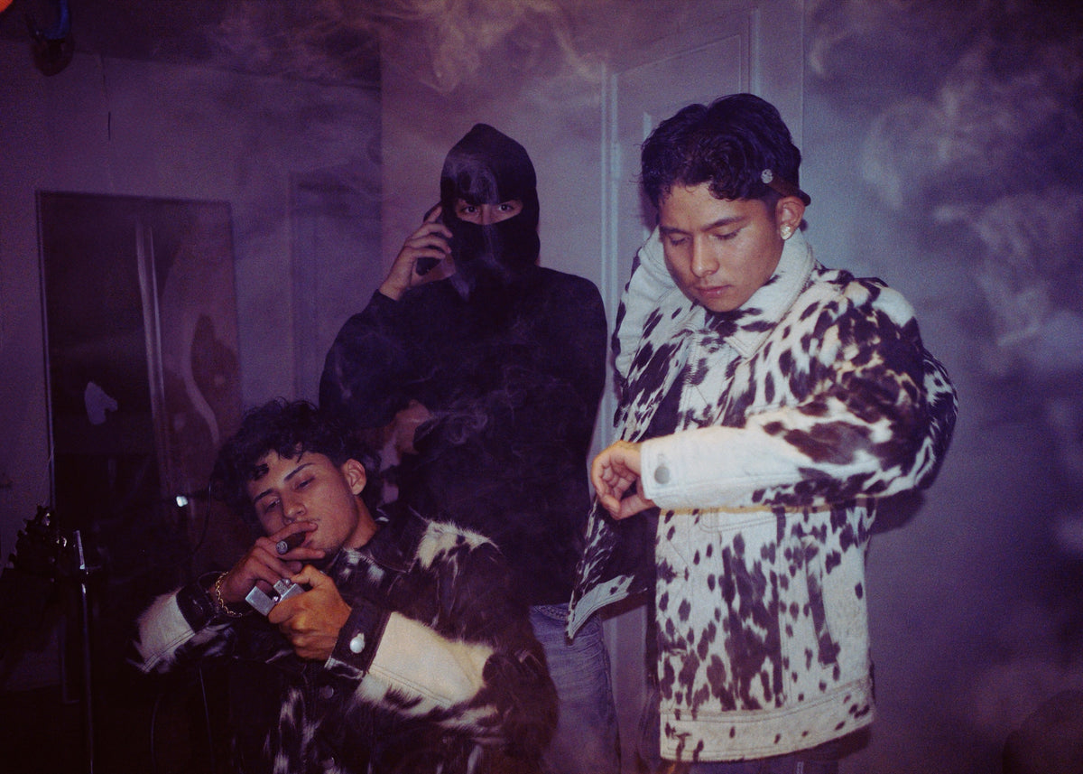 The Third Coast crew at night in cowhide jackets, candid